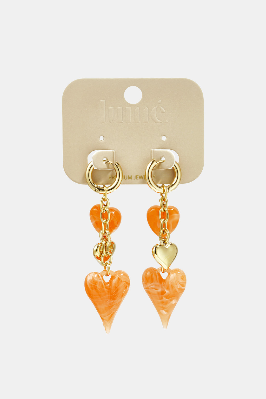 Earrings with dangling hearts on a chain
