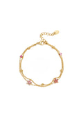 Armband met gekleurde steentjes belegde bloemetjes